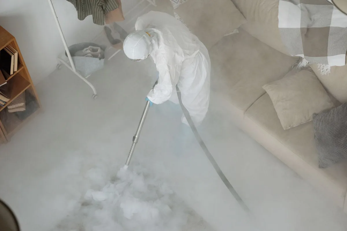 Biohazard cleanup technician in protective equipment, Arvin, CA